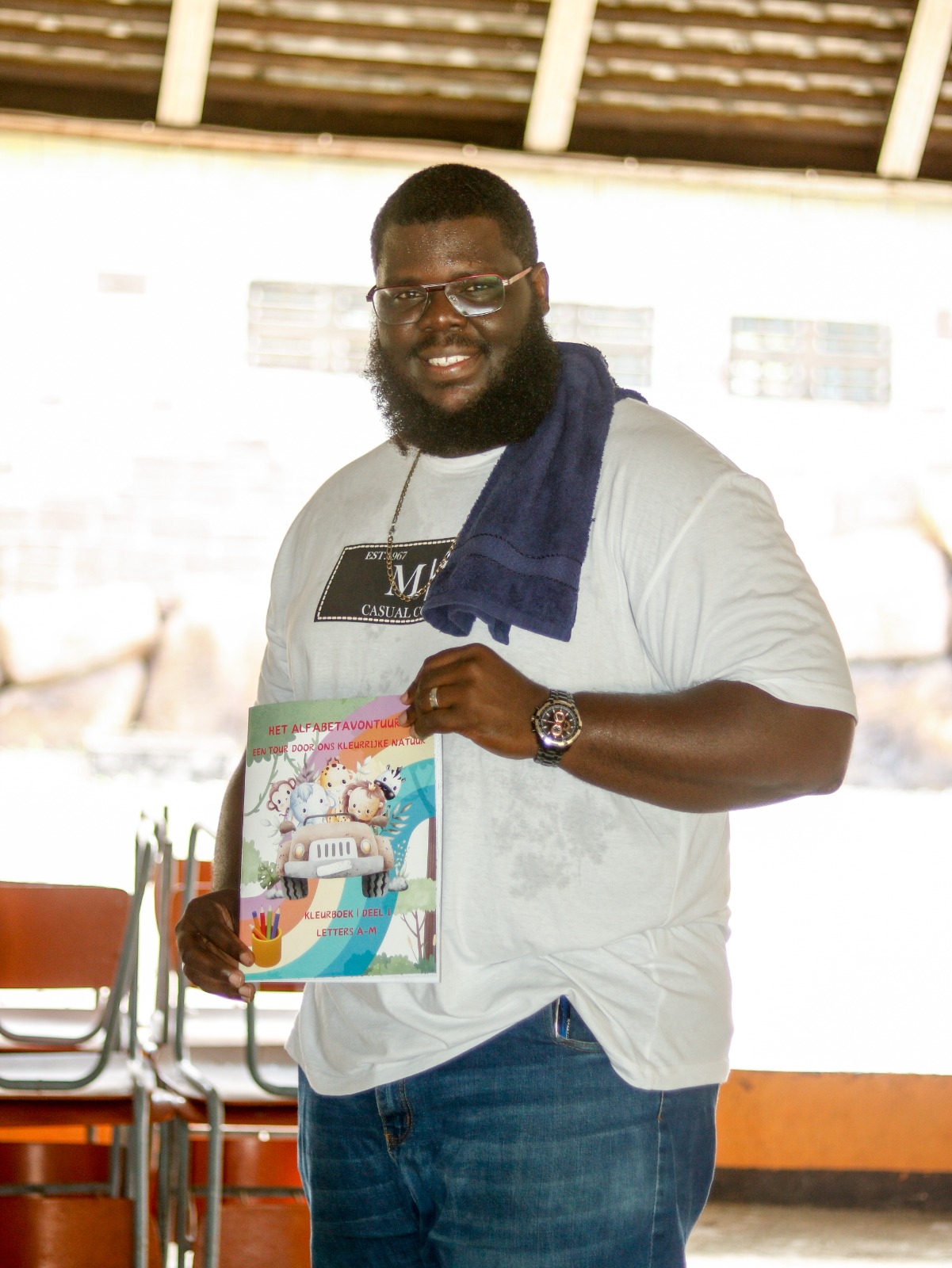 Jonathan from Books by Jonathan proudly holds his book 'The Alphabet Adventure